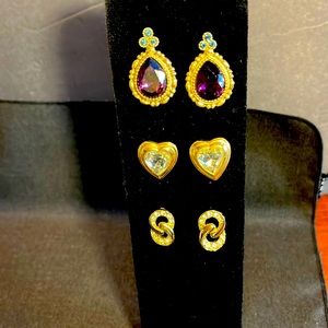 Set of 3 pairs of gold tone pierced earrings. Purple faceted bead,heart crystal